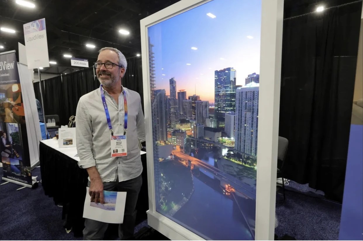 LiquidView founder Mitch Braff stands by a LiquidView digital window at CES Unveiled, Las Vegas, January 5, 2025