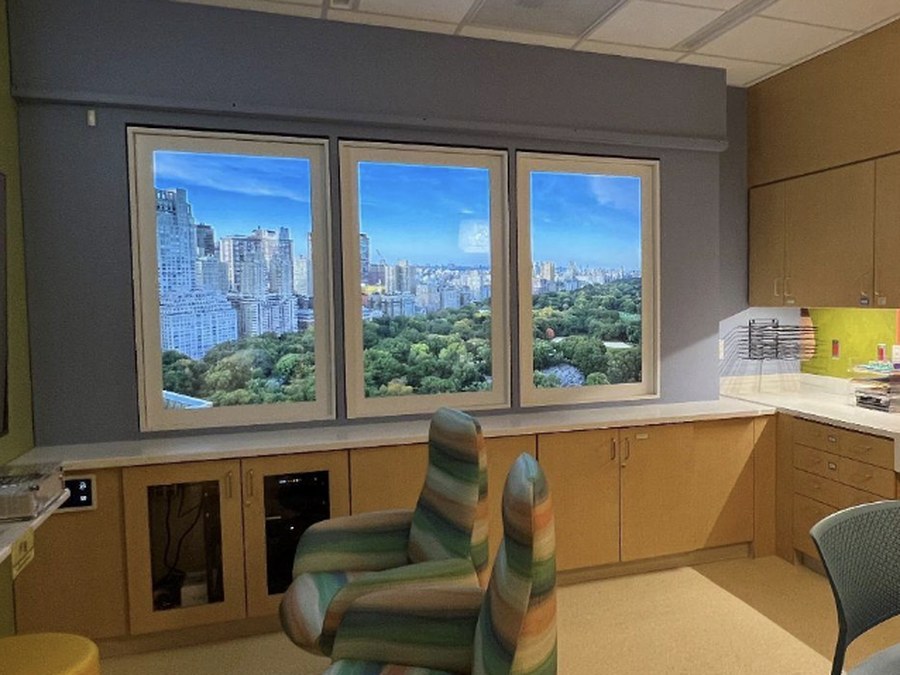 A windowless teen lounge at Buffalo Children's Hospital with a LiquidView window